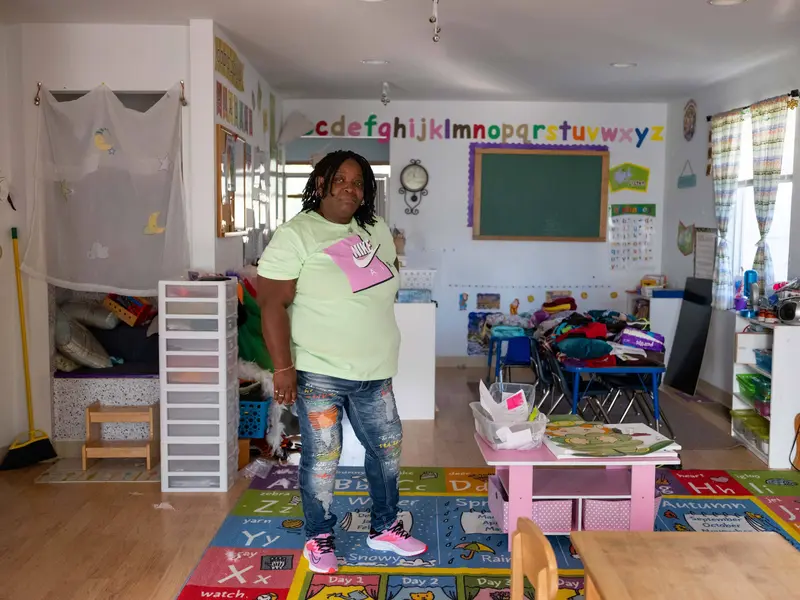 Jackie Thomas standing in the interior of one of her daycare centers.