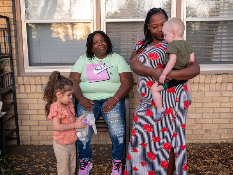 Jackie taking care of children with her daughter Yolanda.