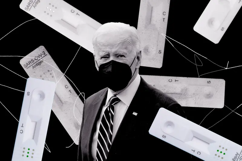 Biden wearing a mask and surrounded by COVID-19 rapid tests.