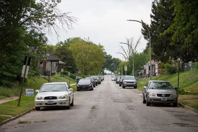 Cars are parked on a residential street.