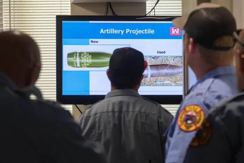 Firefighters view a screen showing "Artillery Projectile" types.